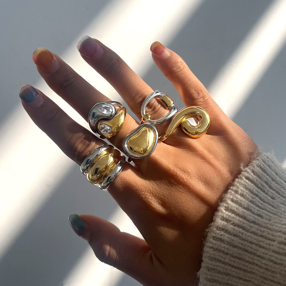 Two-Tone Sculptural Stainless Steel Ring Collection shown on model