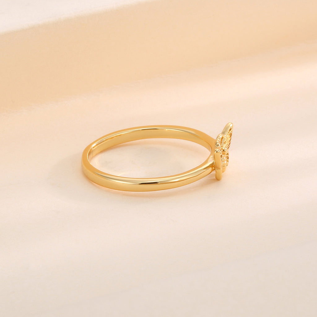 side profile of engraved butterfly centerpiece on gold plated ring
