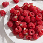 Heart centerpiece bracelet beside raspberries