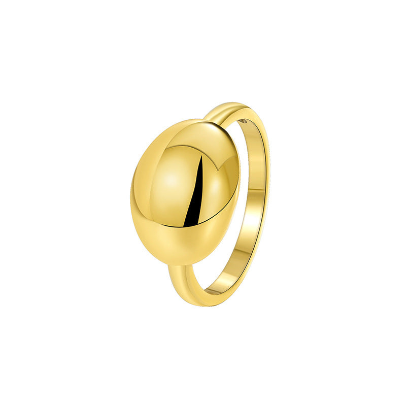 isolated gold plated polished oval dome ring on white