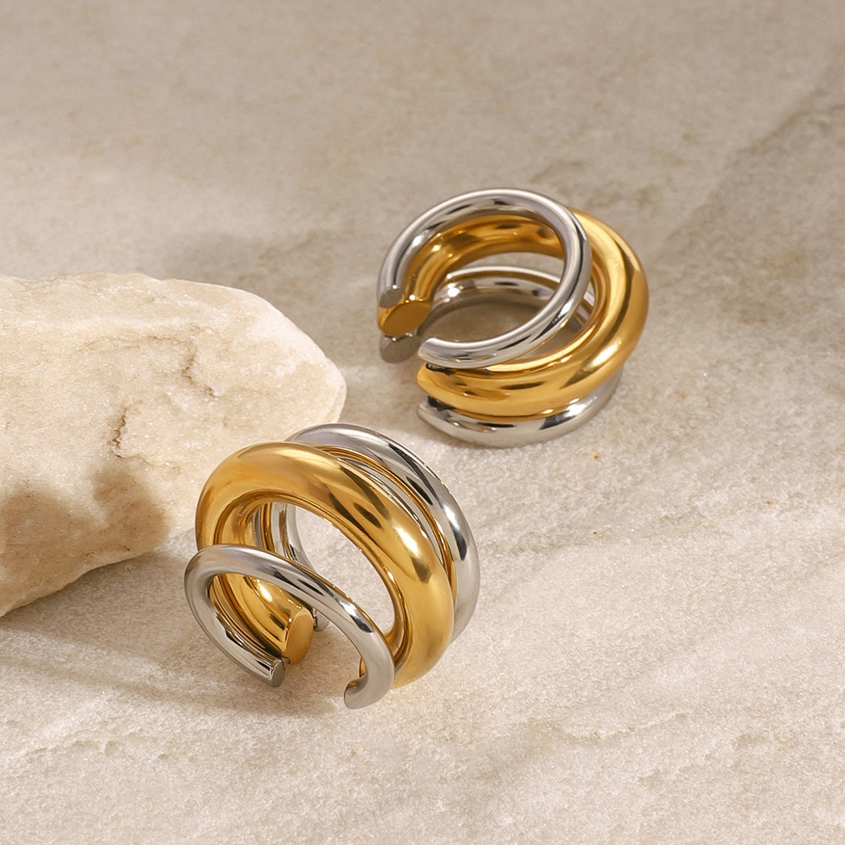 Two-Tone Sculptural Stainless Steel Clip-On Earrings close-up product view
