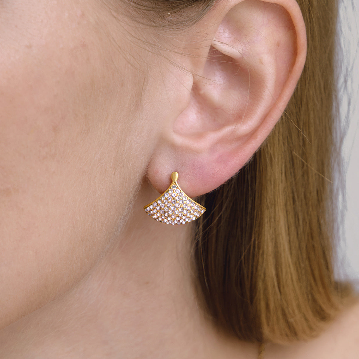 Side view of curved rhinestone fan earring