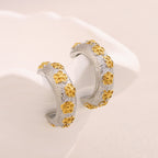two-tone stainless steel C-hoops with gold flower motifs