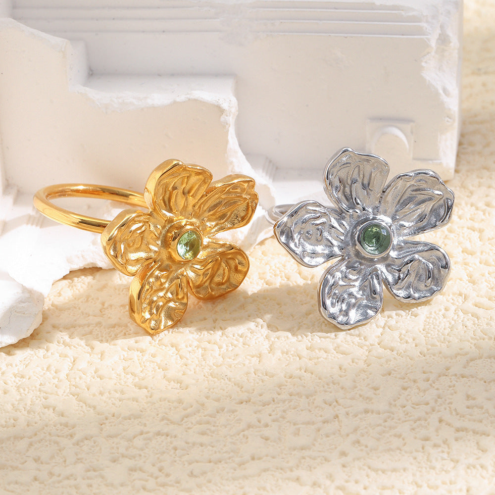 gold plated and silver-finish stainless steel flower rings with green stones