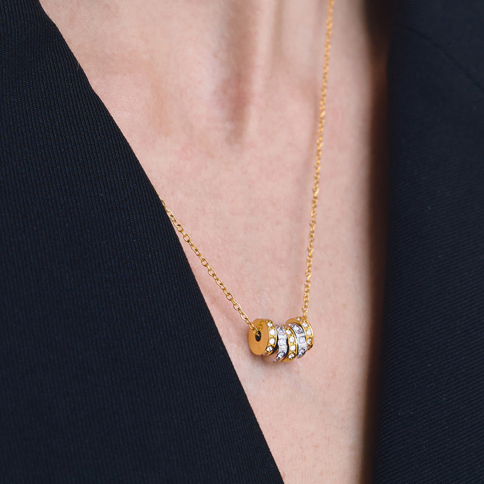 Multicolor cube station stainless steel necklace worn at the neckline
