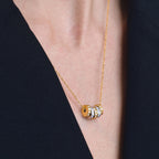 Multicolor cube station stainless steel necklace worn at the neckline
