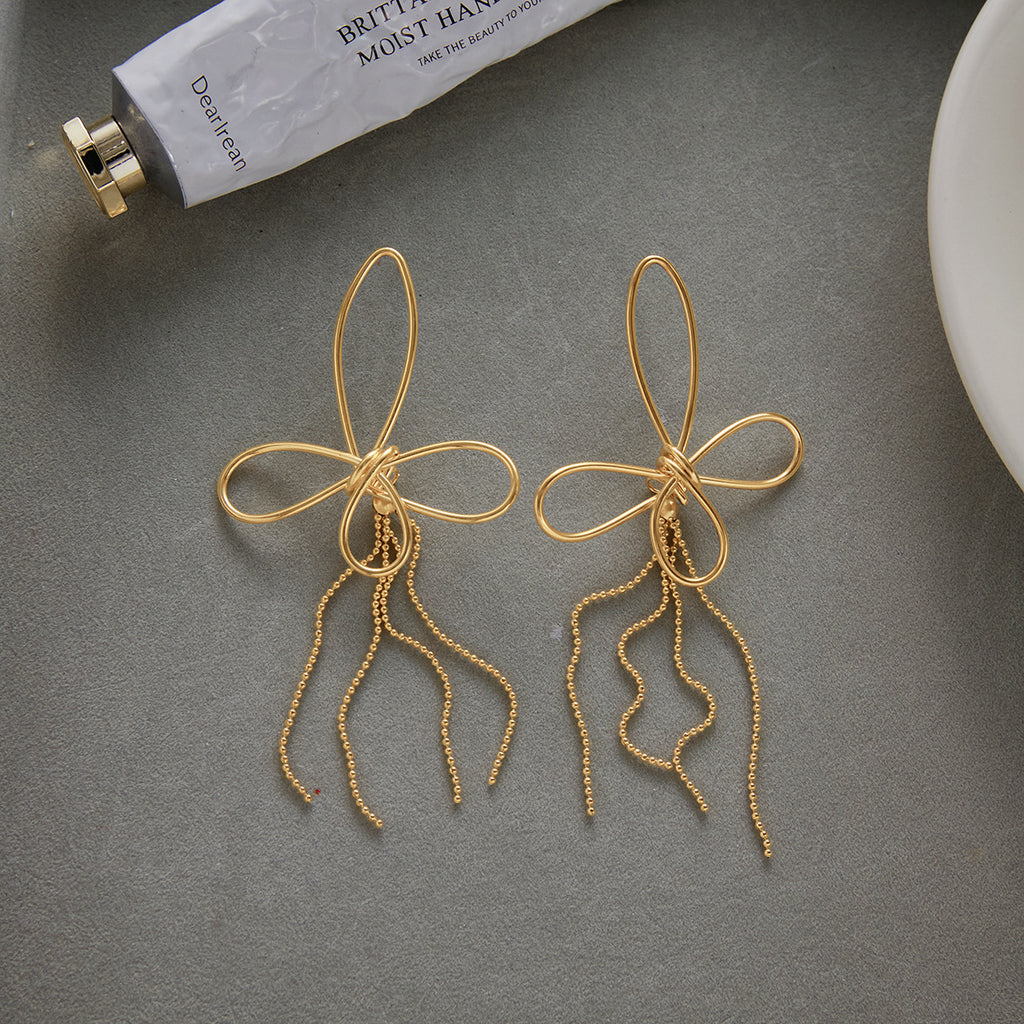 Butterfly Fringe and Star Drop Stainless Steel Earrings — styled view of the butterfly pair