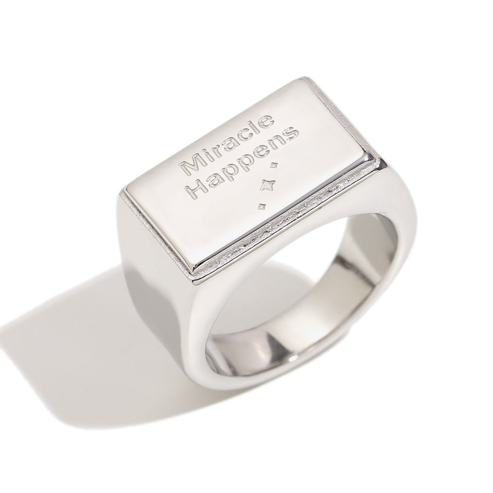 isolated silver-finish Miracle Happens message signet ring