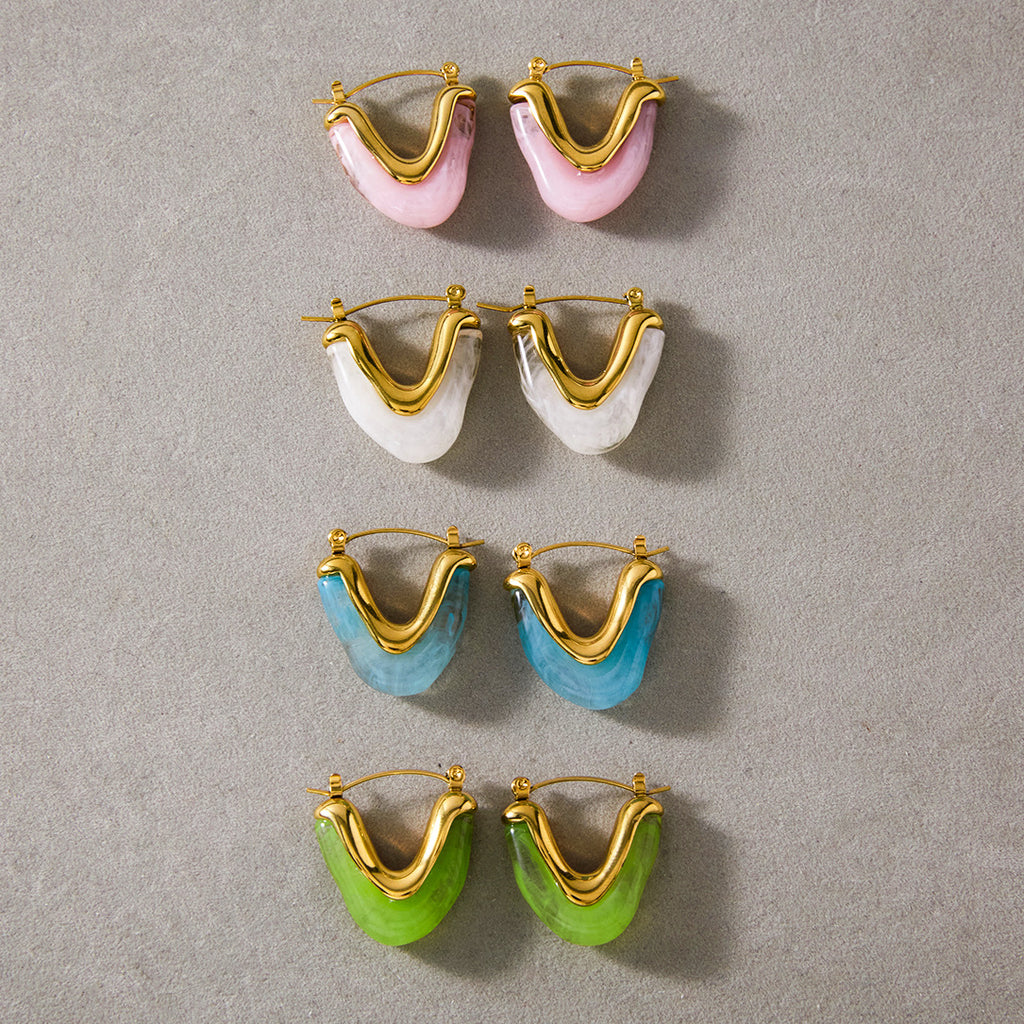Four resin U-shaped hoop colorways arranged together