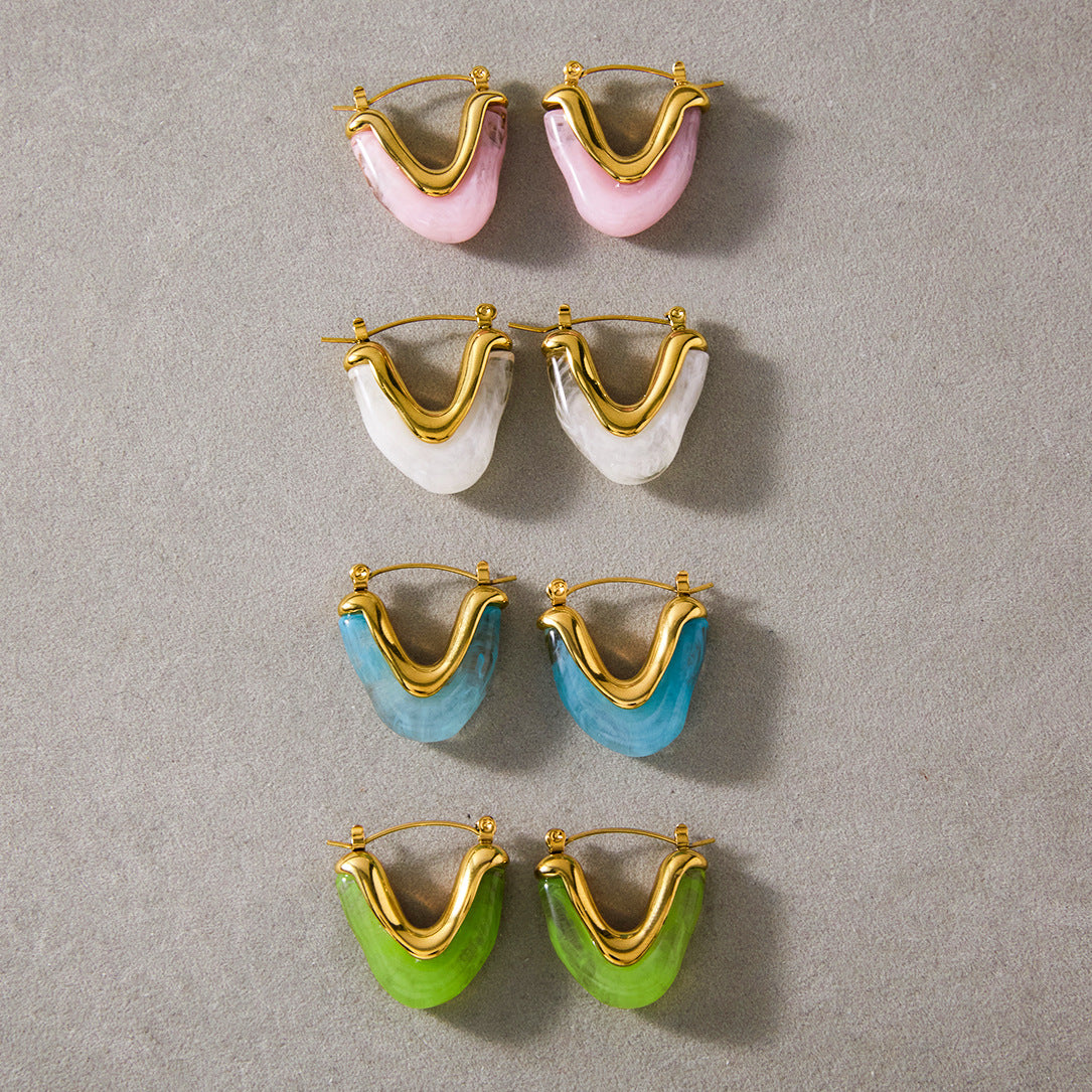 Four resin U-shaped hoop colorways arranged together