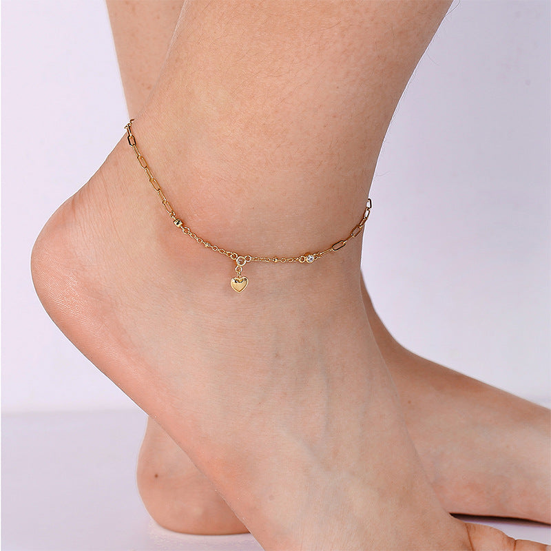 model wearing the heart charm clear stone anklet