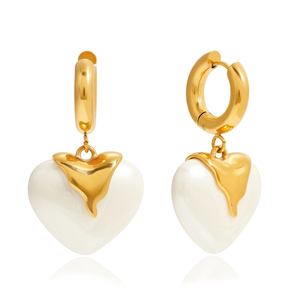 front and side view of the ivory pearlized resin heart earrings