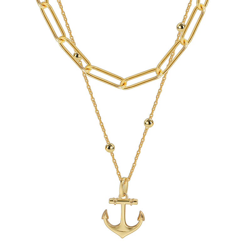 isolated brass layered anchor necklace in gold plating