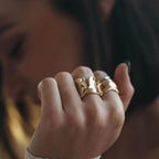 gold plated sculpted wave open ring worn on hand