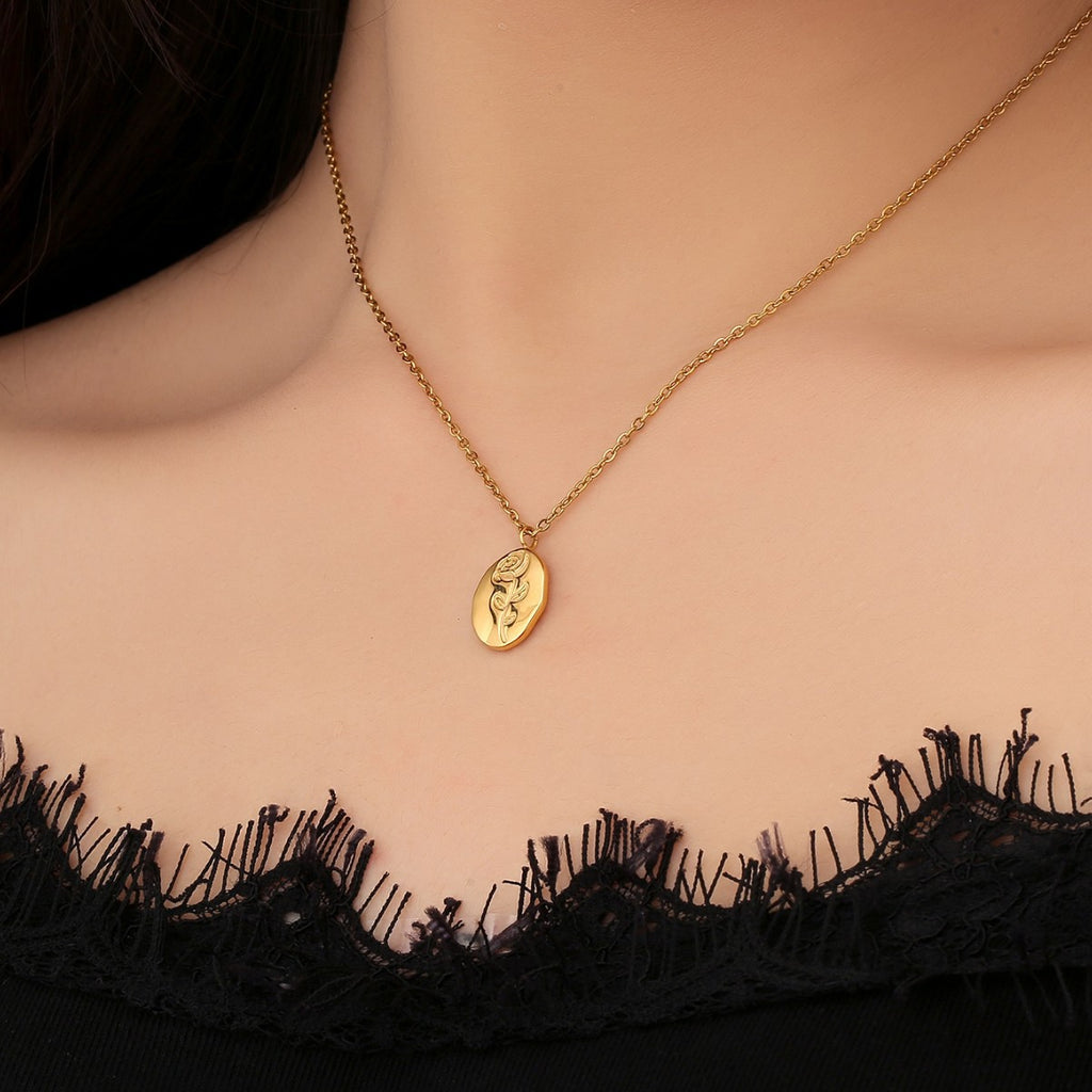 model wearing the petite gold plated rose medallion necklace