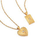 Textured heart and rectangular pendants with small center accents