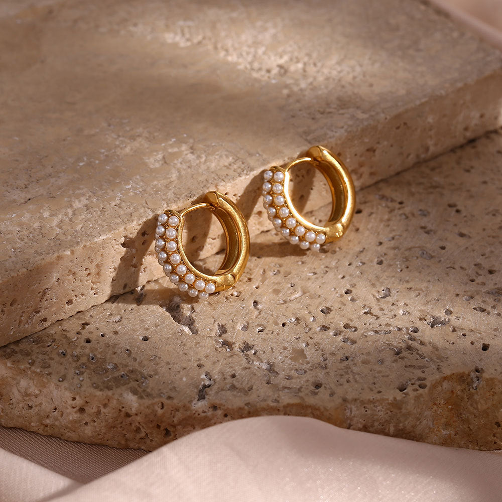 gold plated huggie earrings with layered white pearl trim on stone