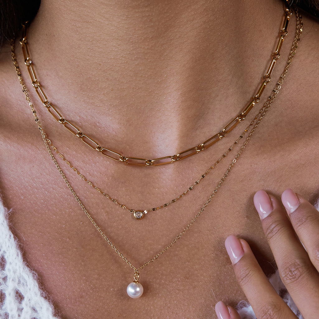 Gold-Tone Clear Accent Stainless Steel Pendant Necklace Collection styled product view