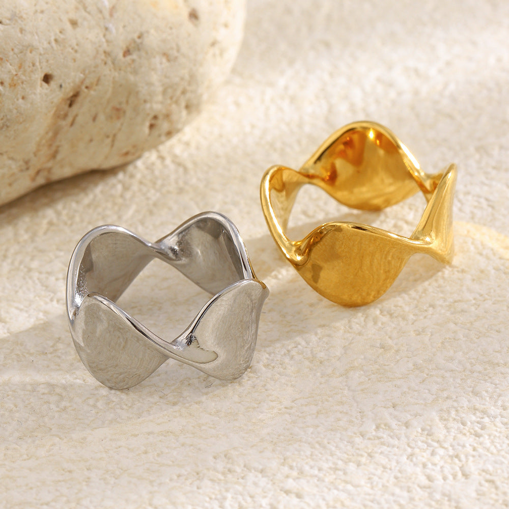 gold plated and silver finish wave rings in a styled setting