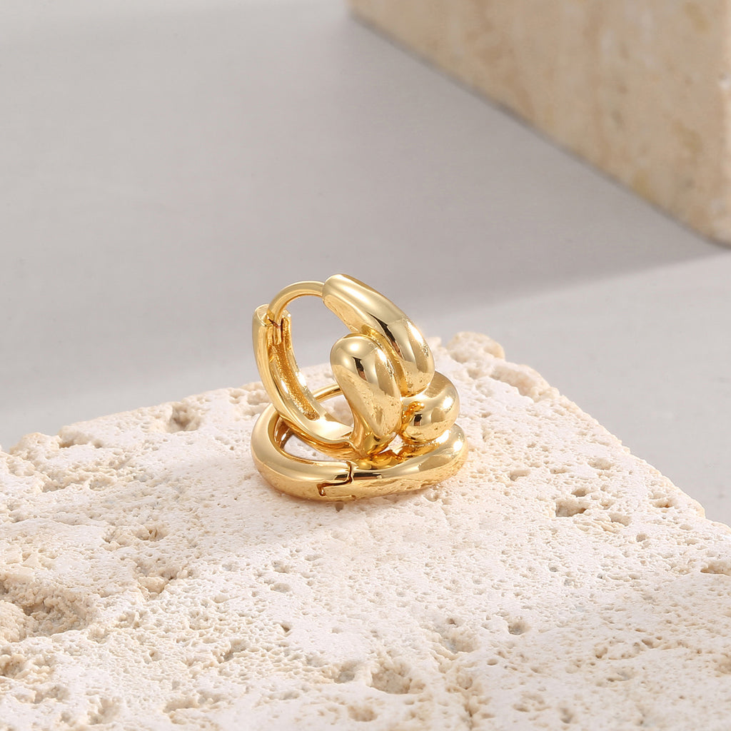 compact sculptural huggie earrings with three rounded front lobes