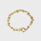isolated gold plated brass chain bracelet with bow-knot link wraps