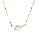 Gold-tone chain necklace with white bead cluster