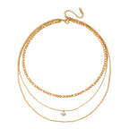 isolated gold plated and silver-finish triple-chain necklaces