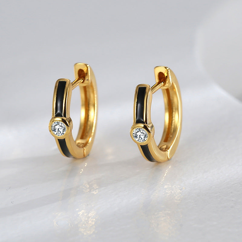 pair of black resin zirconia hoops standing upright