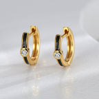 pair of black resin zirconia hoops standing upright