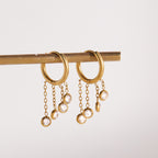 pair of stainless steel hoops with three fine chain drops