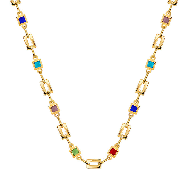 isolated gold plated geometric necklace with colored square accents
