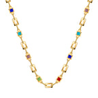 isolated gold plated geometric necklace with colored square accents