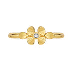 isolated gold plated clover clear stone ring on white