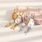 Imitation pearl earrings showing different ring and chain arrangements