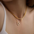 Plain chain layered with a separate clear stone halo necklace