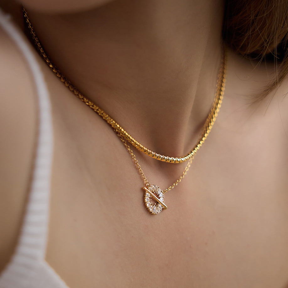 Plain chain layered with a separate clear stone halo necklace