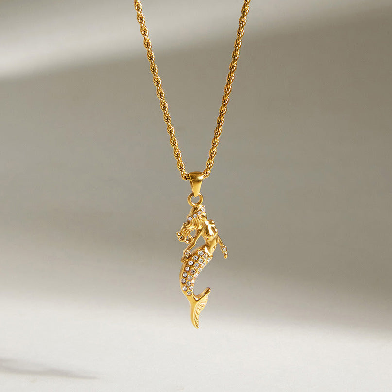 Gold-finish mermaid pendant with clear stones on a rope-style chain