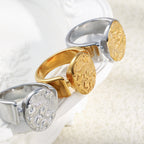 three stainless steel celestial signet ring finish options viewed from the side