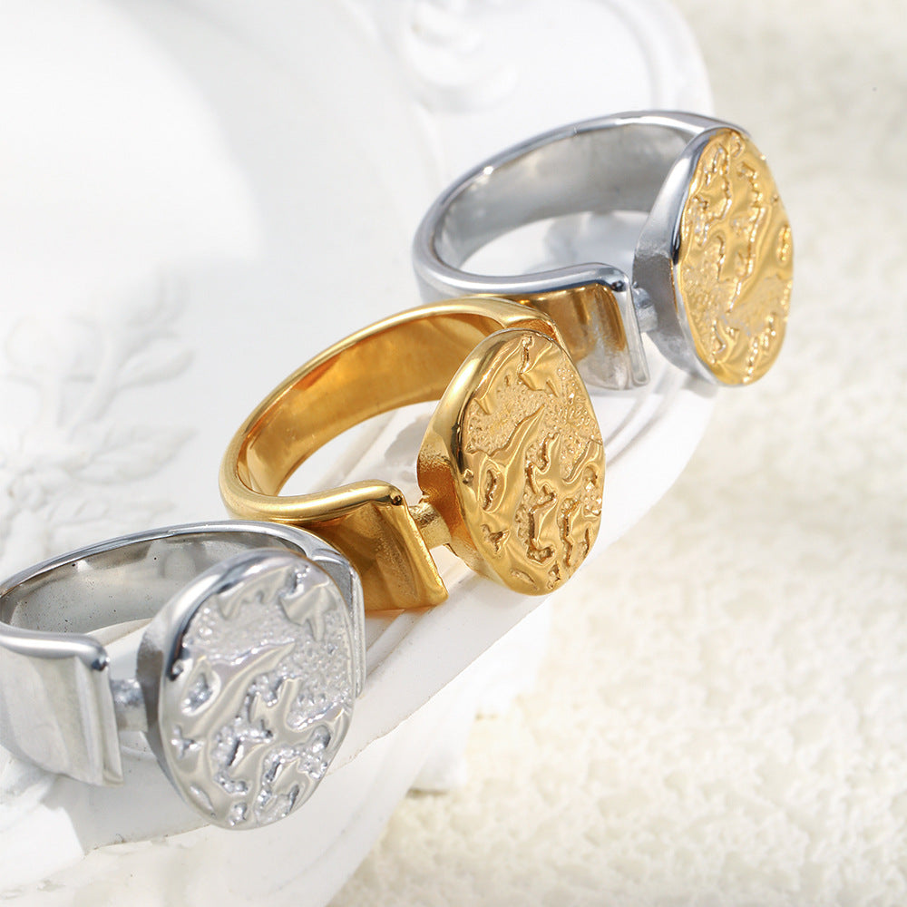three stainless steel celestial signet ring finish options viewed from the side