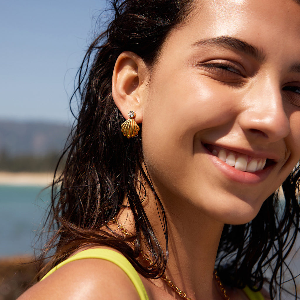 Scallop shell zirconia studs worn outdoors
