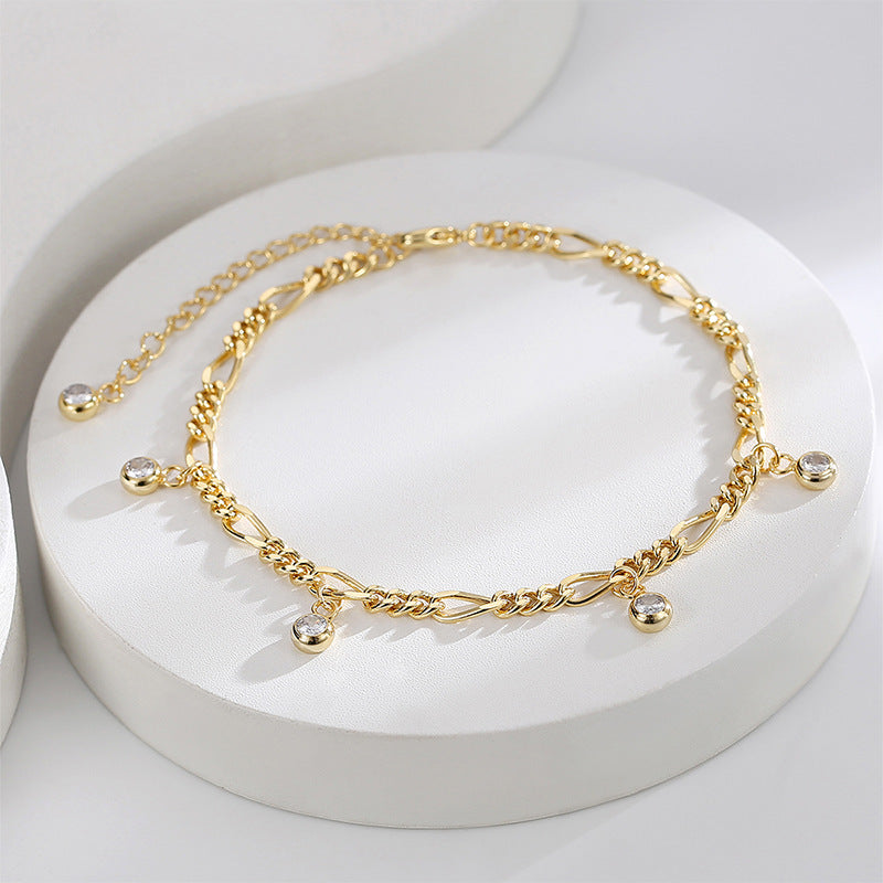 cubic zirconia drop anklet arranged on a white display