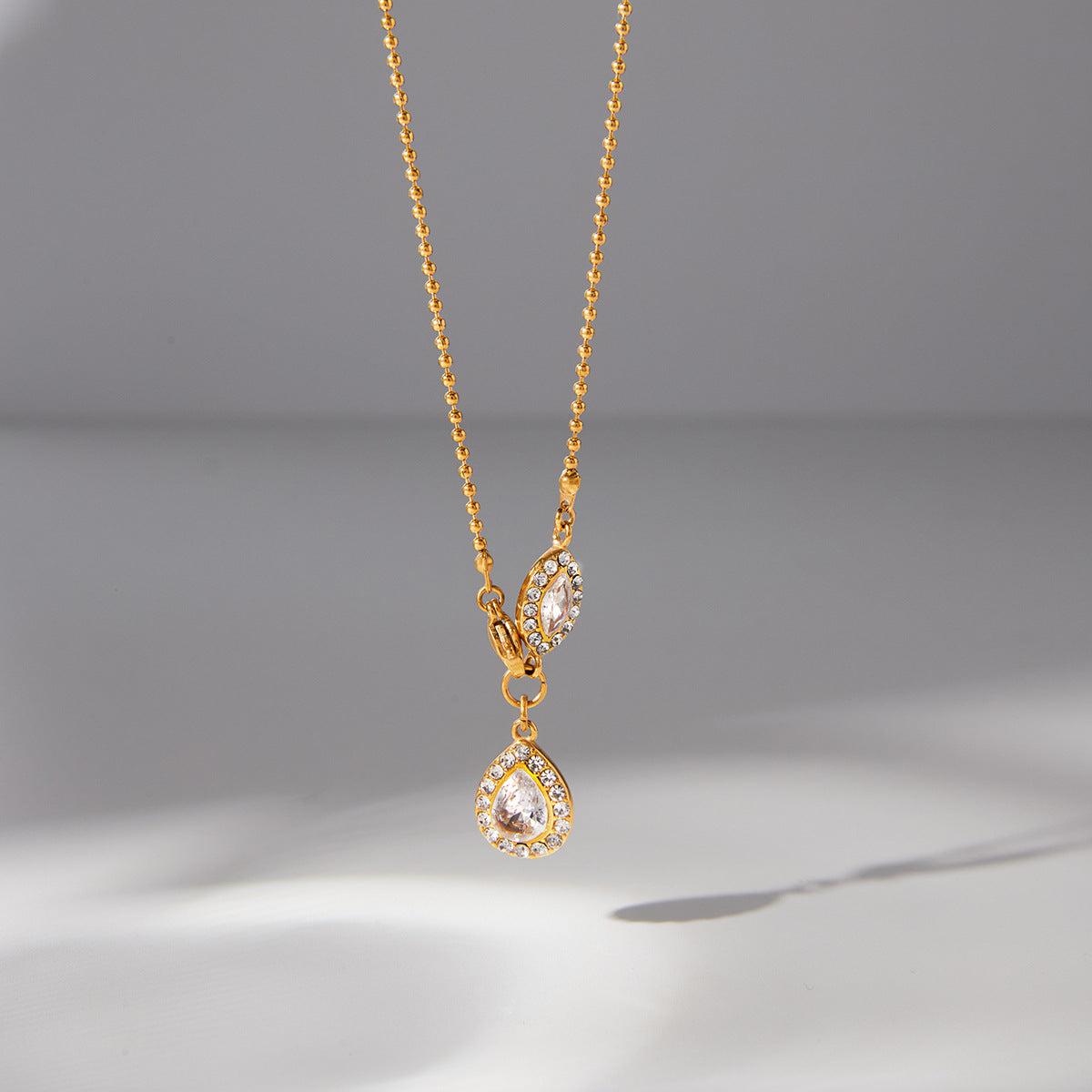 Marquise side accent and pear drop hanging view
