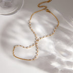Fine links and clear stones on a laid-out hand chain