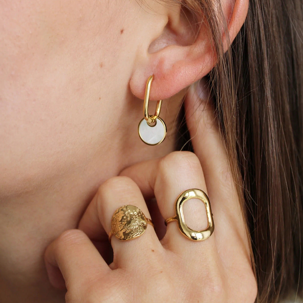 White disc hoop earrings lifestyle close-up