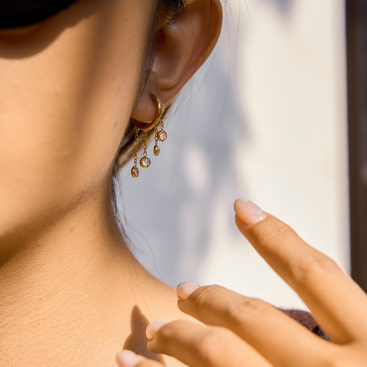 side view of the graduated clear stone chain drop hoops