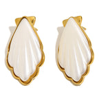 gold plated white shell-shaped acrylic stud earrings on white