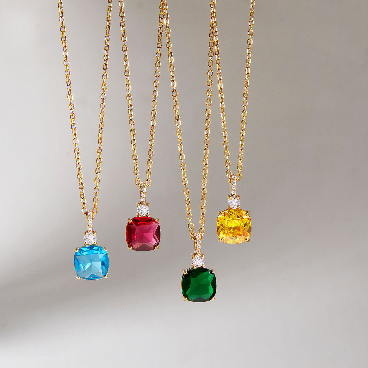 Yellow, blue, red and green necklaces hanging
