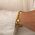 model wearing the gold plated Family message bracelet