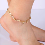 model wearing the mixed-link chevron spike anklet