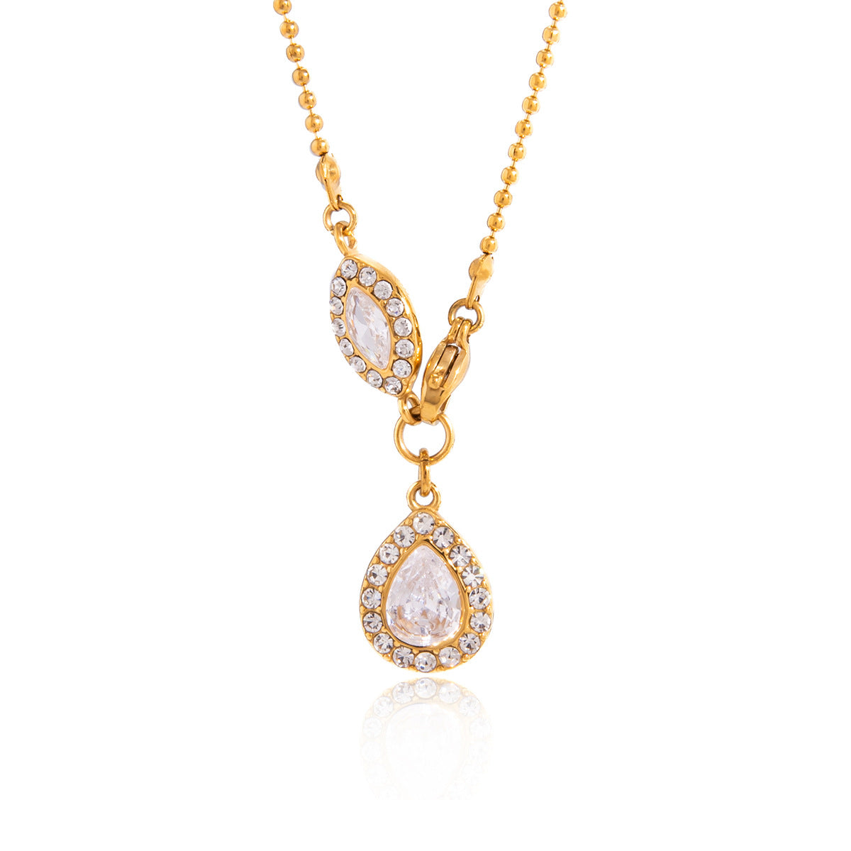Gold-tone pear and marquise necklace on white